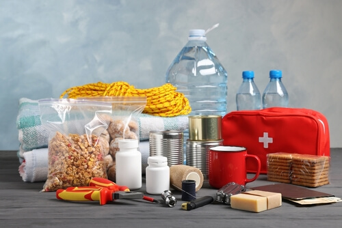 Disaster,Supply,Kit,For,Earthquake,On,Black,Wooden,Table
