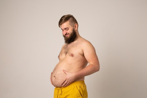 A,Pregnant,Man,Joyfully,Touches,His,Big,Belly.,Fat,Man